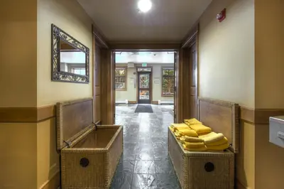 a hallway with a pile of yellow folded towels at Lone Eagle 3024 in Keystone