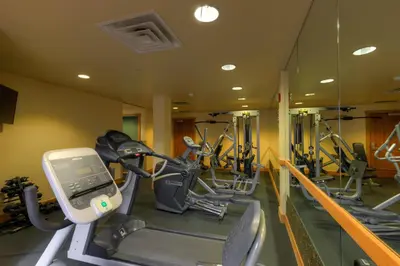 a gym with several tread machines in a row at Expedition Station 8553 in Keystone