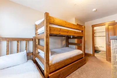 a bedroom with two bunk beds in a house at Springs 8887 in Keystone