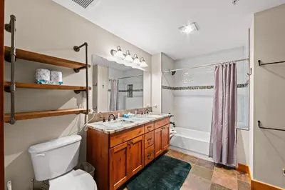 a bathroom with a sink and a toilet at Springs 8887 in Keystone