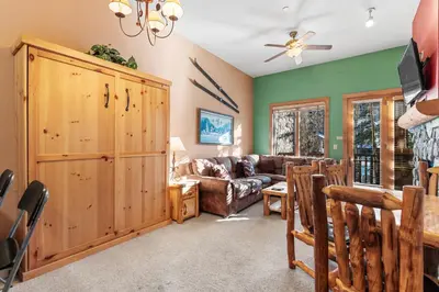 a living room with a couch and a table at Arap Ldg 8101 in Keystone