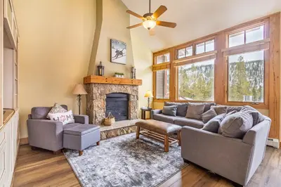 a living room with two couches and a fireplace at Settlers Creek 6545 : 2 in Keystone