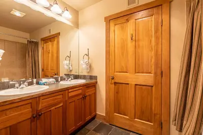 a bathroom with two sinks and a large mirror at Red Hawk Lodge 2271 : 300 in Keystone