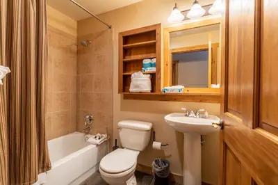 a bathroom with a white toilet and a sink at Red Hawk Lodge 2271 : 300 in Keystone