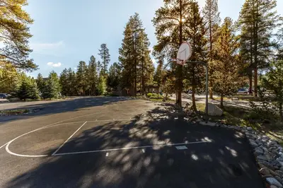 an empty parking lot with a basketball court at Pines 2166 in Keystone