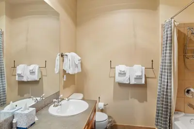 a bathroom with a sink and a toilet and a shower at Red Hawk Lodge 2313 in Keystone