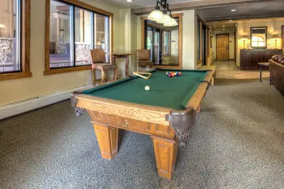 a room with a pool table in a room at Red Hawk Lodge 2313 in Keystone