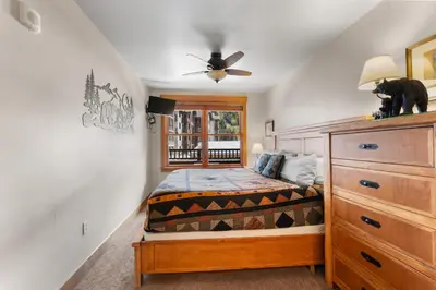 a bedroom with a bed and a ceiling fan at Springs 8845 in Keystone