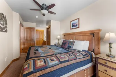 a bedroom with a bed and a ceiling fan at Springs 8845 in Keystone