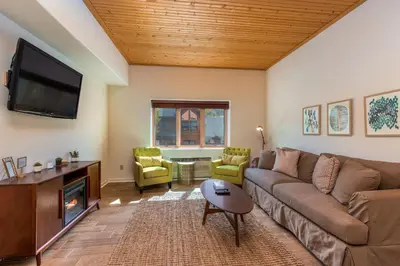 a living room with a couch and a tv at Gateway 5053 in Keystone