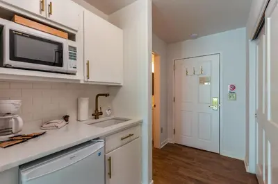 a kitchen with a sink and a microwave at Gateway 5053 in Keystone