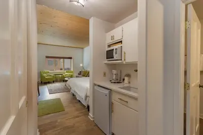 a kitchen with a sink and a bed in a room at Gateway 5053 in Keystone