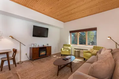 a living room with a couch and a tv at Gateway 5053 in Keystone