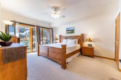 a bedroom with a bed and a window at Gateway 5097 in Keystone