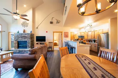 a living room with a couch and a table at Gateway 5097 in Keystone