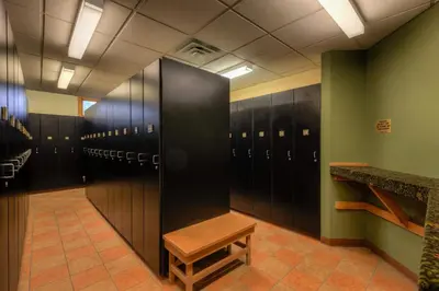 a locker room with a bench and lockers at Expedition Station 8581 in Keystone
