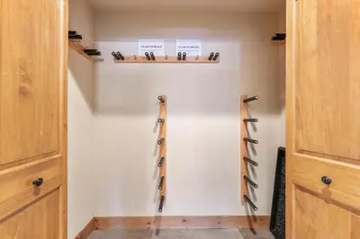 a room with wooden cabinets and a wall with three wooden shelves at Timbers 3073: 2250 in Keystone