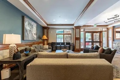 a living room with a couch and a table at Lone Eagle 3021 in Keystone