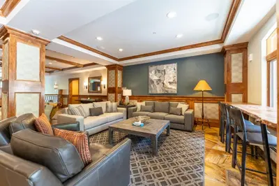 a living room with couches and a table at Lone Eagle 3021 in Keystone
