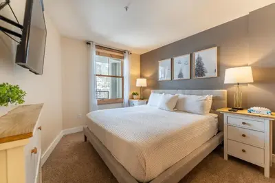 a bedroom with a large bed and a window at Silver Mill 8266 in Keystone
