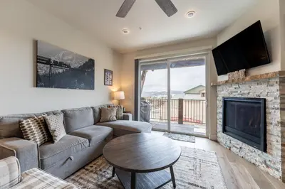 a living room with a couch and a fireplace at Sail Lofts 303 in Dillon