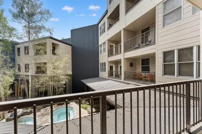 an apartment building with a balcony and a swimming pool at Silver Mill 8171 in Keystone