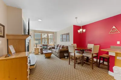 a living room with a couch and a dining room at Silver Mill 8171 in Keystone