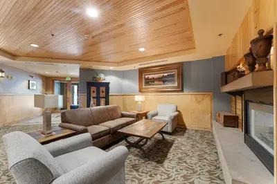 a living room with a couch and a fireplace at Silver Mill 8171 in Keystone