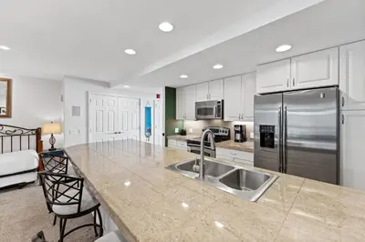 a kitchen with a sink and a stainless steel refrigerator at Saints John 2500 in Keystone