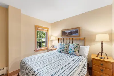 a bedroom with a bed and a window at Expedition Station 8576 in Keystone