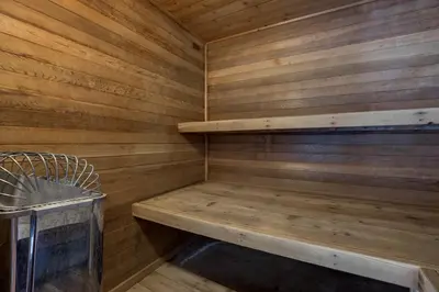 a small wooden sauna with a bench in it at Ski Run 412 in Keystone