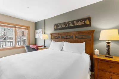 a bedroom with a white bed and a window at Expedition Station 8571 in Keystone