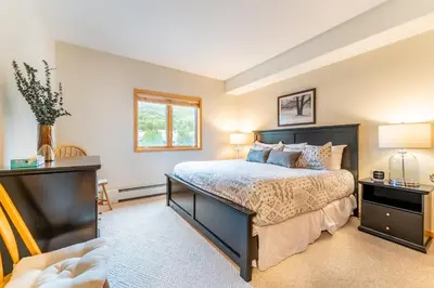 a bedroom with a large bed and a window at Gateway 5098 in Keystone