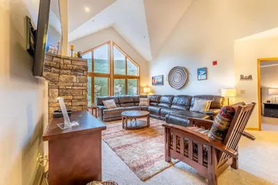 a living room with a couch and a table at Gateway 5098 in Keystone