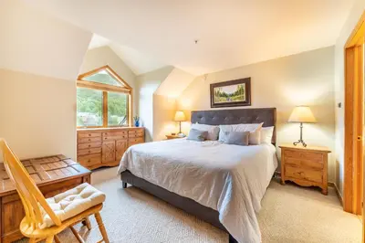 a bedroom with a large bed and a window at Gateway 5098 in Keystone