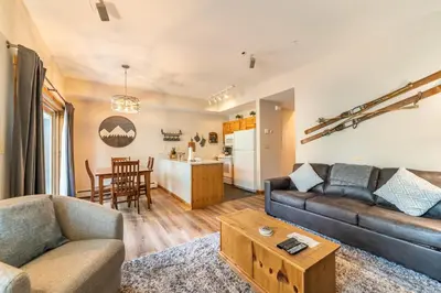a living room with a couch and a table at Seasons at Keystone 1836 in Keystone