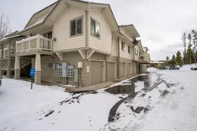 a house with a puddle of water in the street at Prospect Point Townhomes 202C in Frisco