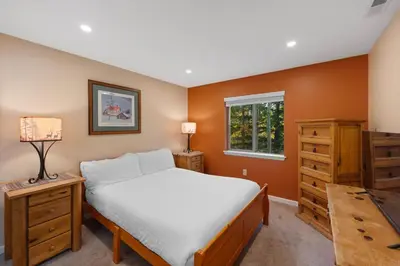 a bedroom with a bed and a dresser and a window at Prospect Point Townhomes 202C in Frisco