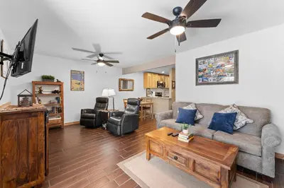 a living room with a couch and a tv at Snowdance 103 Building A in Keystone