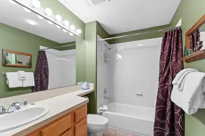 a bathroom with a tub and a sink and a toilet at Gateway 5036 in Keystone