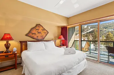 a bedroom with a bed and a large window at Gateway 5036 in Keystone