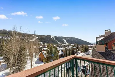 a view from the balcony of a house in the snow at Gateway 5036 in Keystone