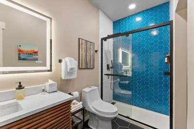 a bathroom with a toilet and a glass shower at Lake Cliffe 307 Building A in Dillon