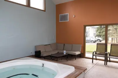 a large bath tub in a living room with a couch at Lake Cliffe 307 Building A in Dillon