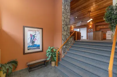 a staircase in a building with a poster on the wall at Lake Cliffe 307 Building A in Dillon