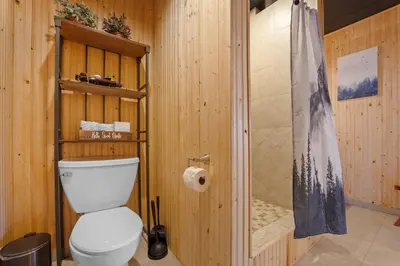 a bathroom with a toilet and a shower at Lakeshore 4 in Keystone