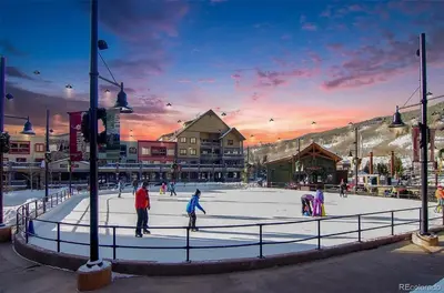 a group of people skating on an ice rink at Lakeshore 4 in Keystone