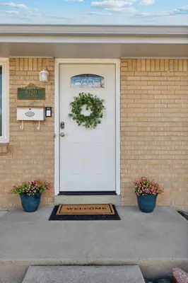 a house with a white door with a wreath on it at Family-friendly | Ping-Pong | Game Rm | Fast Wifi in Arvada