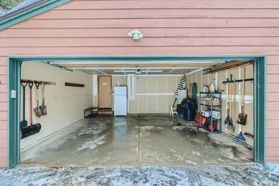 a garage with a garage door open with a lot of snow at Gold Dust 660A in Frisco