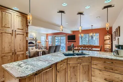 a kitchen with wooden cabinets and a large counter top at Gold Dust 660A in Frisco